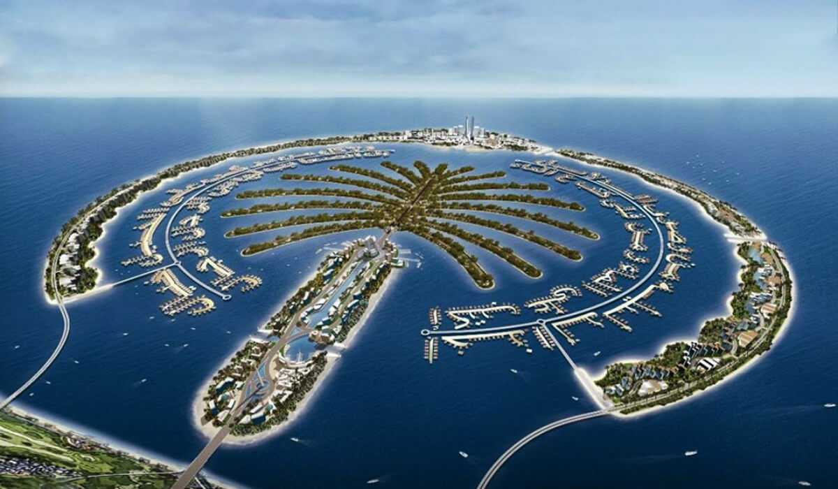 Top view of Palm Jebel Ali, showcasing the palm-shaped man-made island with its sprawling branches, luxury villas, and modern infrastructure, surrounded by turquoise waters.