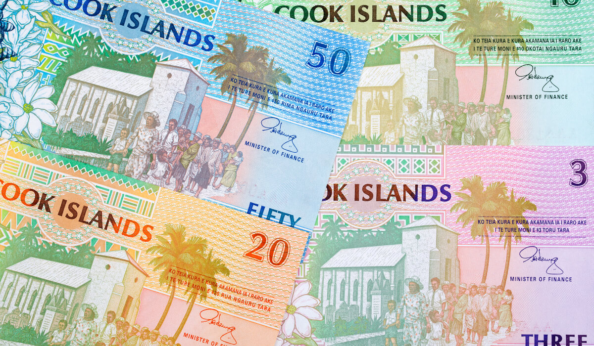 Stack of colorful Cook Islands banknotes placed on top of each other.