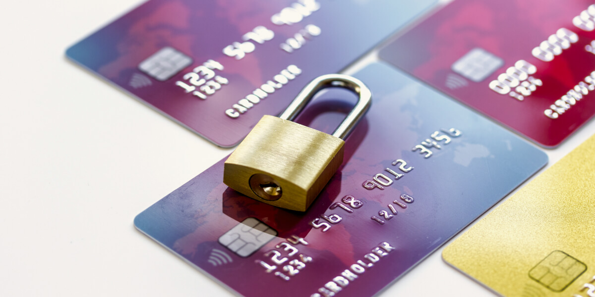 A padlock placed on top of a credit card, symbolizing secure transactions.