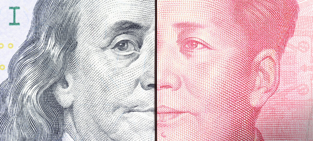 A split-image of the US dollar and Chinese yuan banknotes featuring close-up portraits, symbolizing economic rivalry.