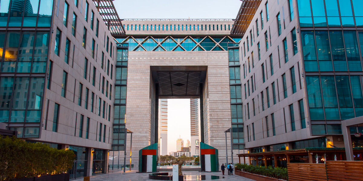 A modern business district entrance with high-rise buildings.