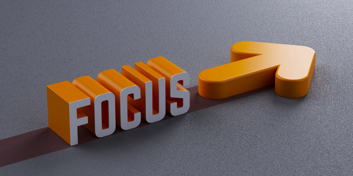 3D text displaying "FOCUS" in bold orange and white design.