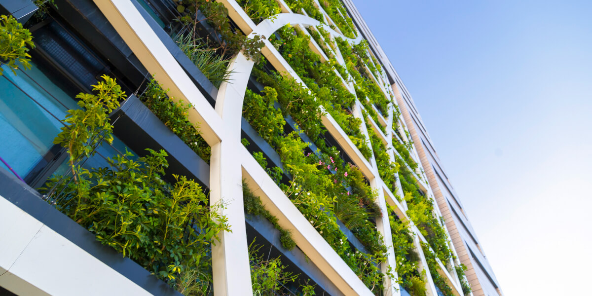 Vertical garden on a modern building facade, blending architecture with sustainable greenery.