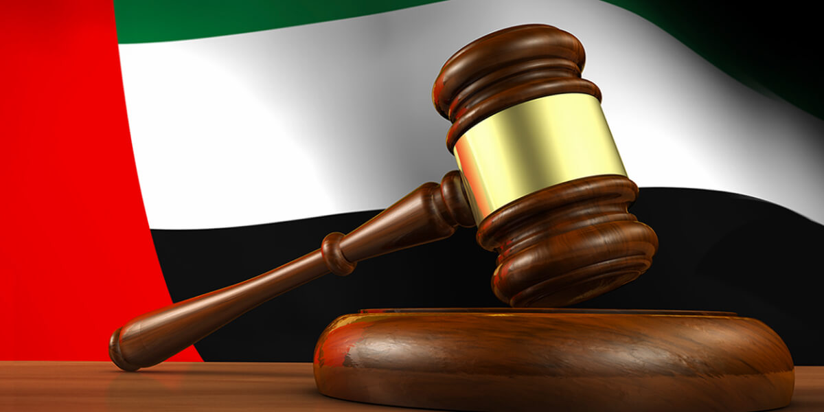 Gavel in front of the UAE flag, symbolizing legal or regulatory matters in the UAE.