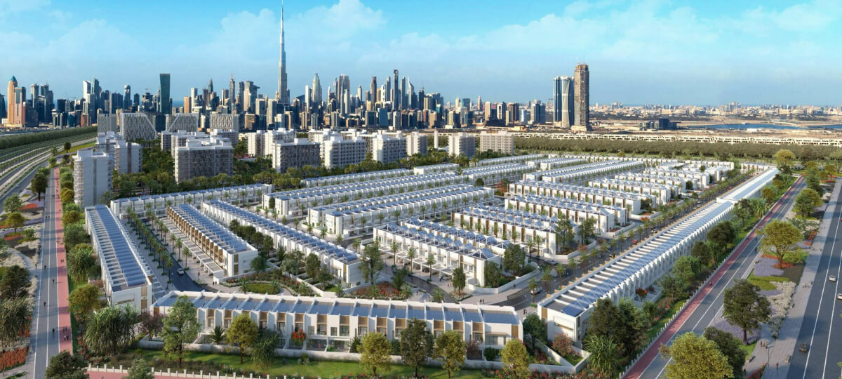 Large residential housing development with Burj Khalifa in the background, highlighting urban planning and growth.