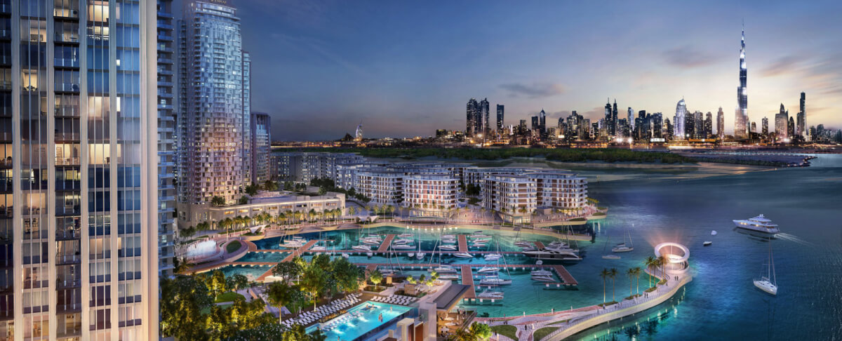 Luxurious marina development with high-rises and moored yachts in Dubai.