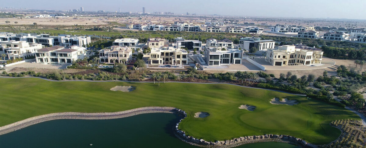 Luxury villas overlooking a golf course in an upscale Dubai neighborhood.
