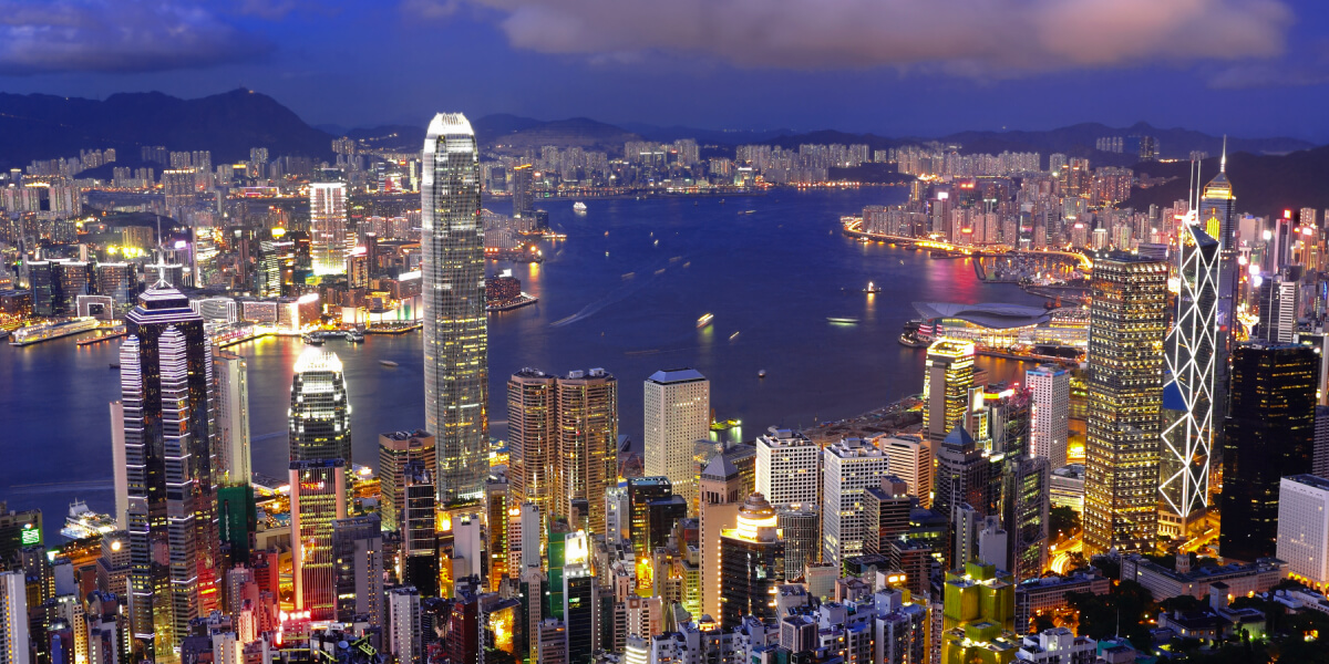 A night view of Hong Kong’s illuminated skyline and Victoria Harbour.